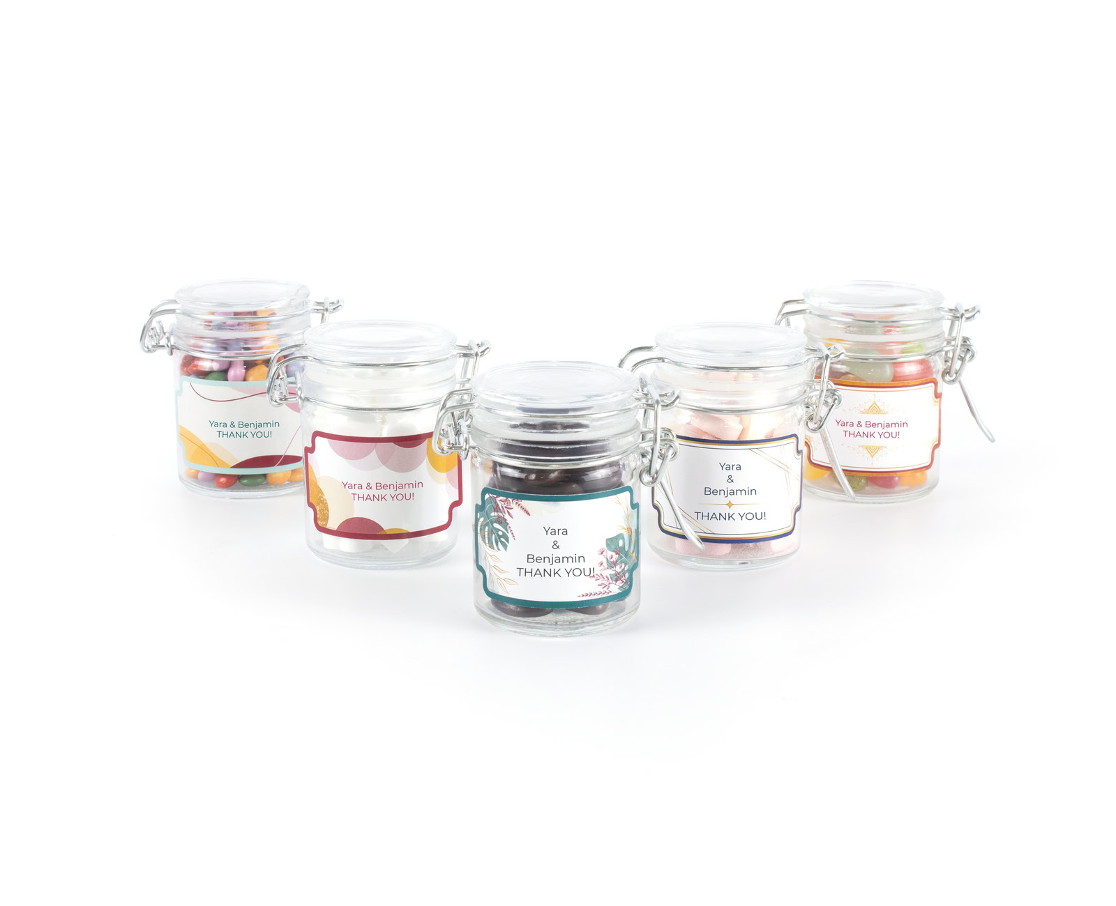 five small wedding thank you candy jars with personalised labels in different designs and with different fillings