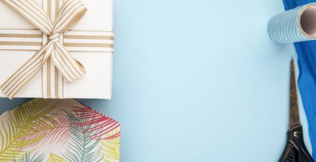 topview giftbox tied with a bow with a blue background