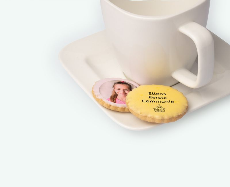 Licorice biscuits with printing presented on even dish as spring party thank-you gift