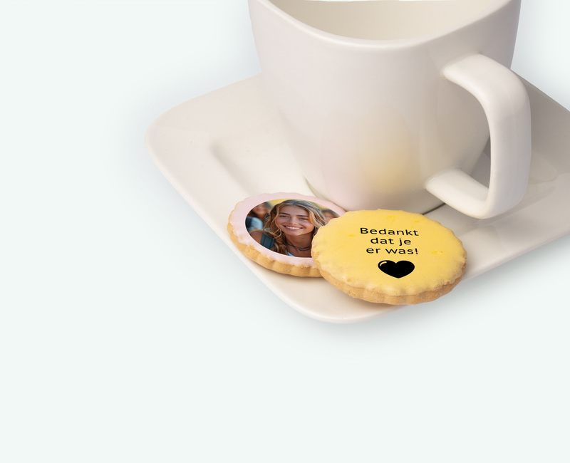 Printed licorice biscuits with text and photo presented on a platter