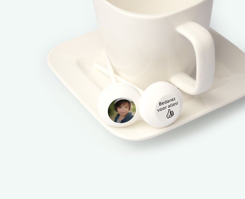 Printed lollipop with text presented on a saucer