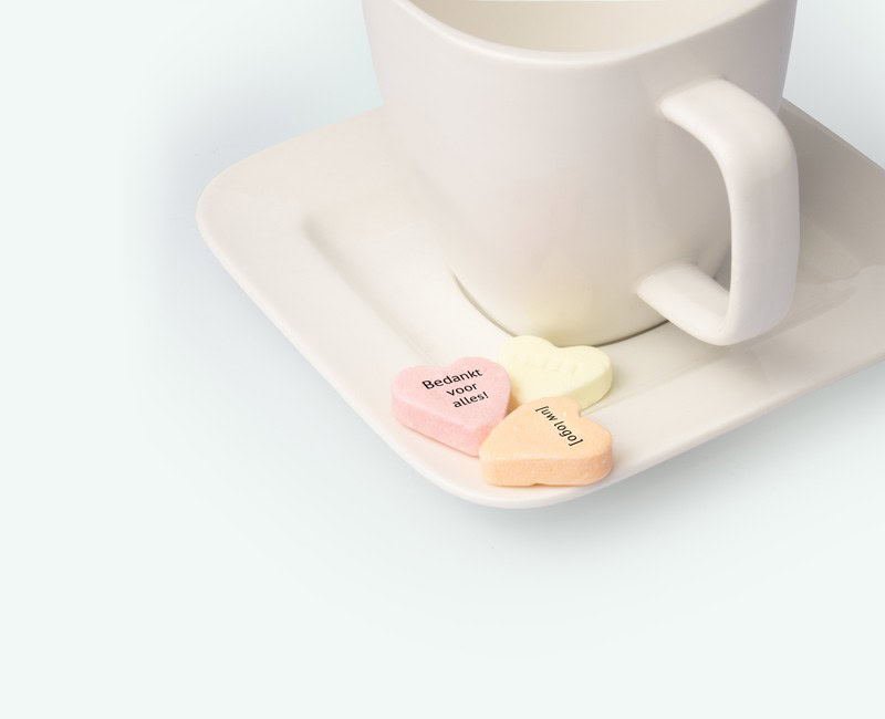 Fruit hearts with logo displayed on a saucer deployed as a promotional gift
