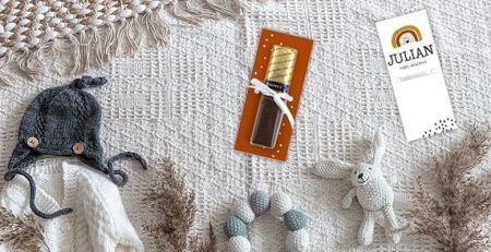 Blogafbeelding voor een babyshower met een Merci en regenboog