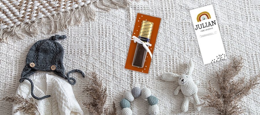 Blogafbeelding voor een babyshower met een Merci en regenboog